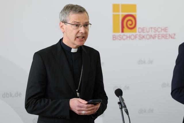 24 February 2026, Bavaria, Wuerzburg: Bishop Heiner Wilmer, new Chairman of the German Bishops' Conference, speaks at a press conference following his election. Photo: Daniel Löb/dpa