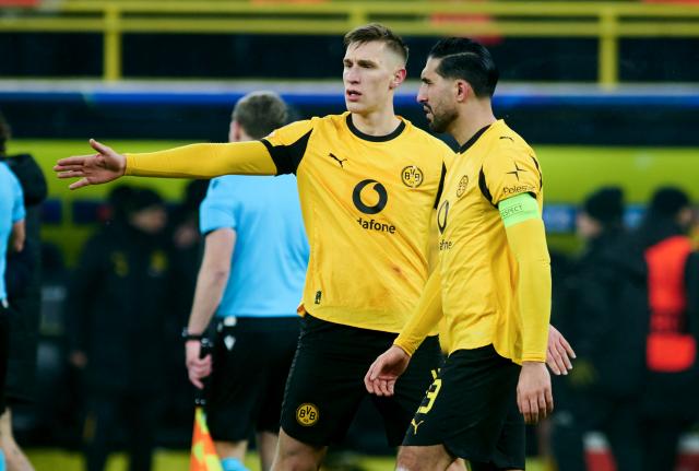 FILED - 28 January 2026, North Rhine-Westphalia, Dortmund: Borussia Dortmund's Nico Schlotterbeck (L) and Emre Can react after the UEFA Champions League soccer match between Borussia Dortmund and Inter Milan at Signal Iduna Park. Defenders Nico Schlotterbeck and Emre Can have taken part in Borussia Dortmund's final team training on Tuesday ahead of the Champions League play-off return leg at Atalanta. Photo: Bernd Thissen/dpa
