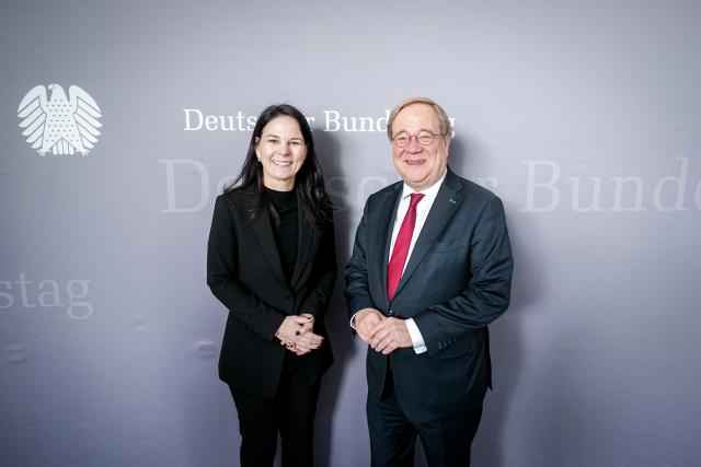 25 February 2026, Berlin: Annalena Baerbock, President of the United Nations General Assembly, is greeted by Committee Chairman Armin Laschet before the meeting of the Bundestag Committee on Foreign Affairs. Photo: Kay Nietfeld/dpa