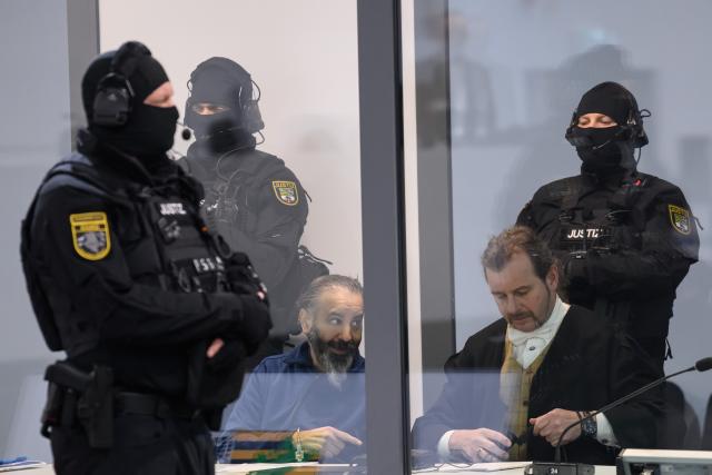 25 February 2026, Saxony-Anhalt, Magdeburg: Defendant Taleb al-Abdulmohsen (L) sits in the dock in the courtroom of the temporary court building at Magdeburg District Court next to Public defender Thomas Rutkowski (R). The trial against the Taleb, for driving over people at the Magdeburg Christmas Market is being continued. The public prosecutor's office is accusing the man from Saudi Arabia of 338 counts of attempted murder. Photo: Klaus-Dietmar Gabbert/dpa