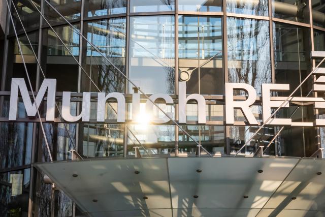 FILED - 21 April 2021, Bavaria, Munich: Munich Re logo and lettering at the main entrance of the administration building in Munich's Schwabing district. Photo: Peter Kneffel/dpa