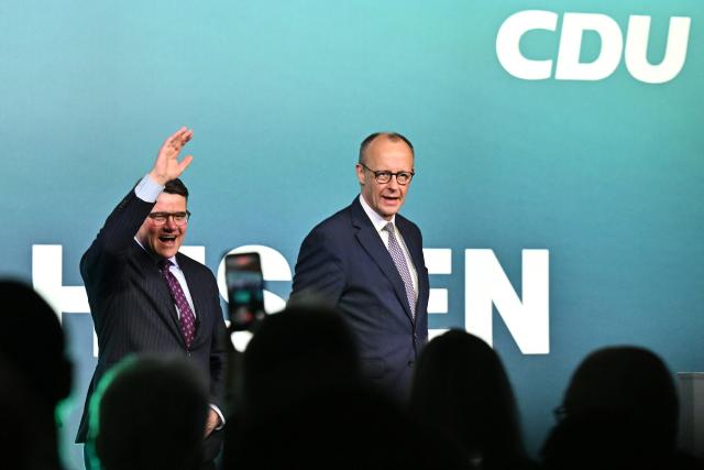 27 February 2026, Hesse, Volkmarsen: Germany's Chancellor Friedrich Merz (R) and Boris Rhein, Minister President of Hesse and State Chairman of the CDU Hesse, arrive at an election campaign event in the Nordhessenhalle. Photo: Swen Pförtner/dpa