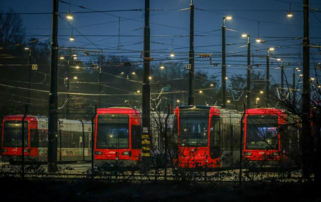 28 February 2026, Bremen: Streetcars stand at dawn in a depot of Bremer Strassenbahn AG (BSAG) on the second day of a two-day warning strike in local transport. The Verdi trade union has called on its members to go on strike on Friday and Saturday. Photo: Focke Strangmann/dpa