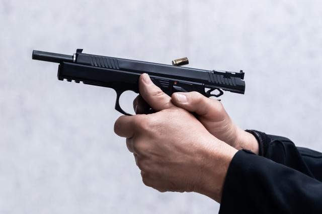 FILED - 19 September 2025, Baden-Württemberg, ---: A man shoots at a target in a shooting range with a semi-automatic handgun in 9 mm Luger caliber. Photo: Silas Stein/dpa