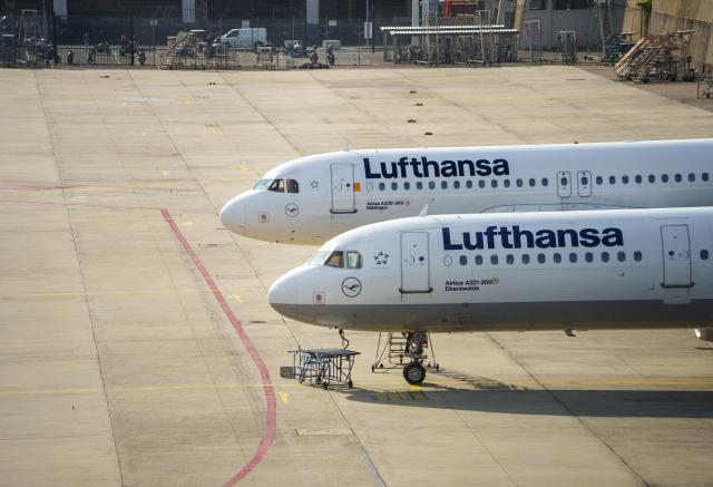 FILED - 30 September 2025, Hesse, Frankfurt/Main: Two Lufthansa aircraft are parked in an open area in front of a maintenance hangar at Frankfurt Airport. Photo: Andreas Arnold/dpa