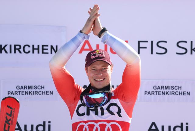28 February 2026, Bavaria, Garmisch-Partenkirchen: Switzerland's winner Marco Odermatt celebrates during the the award ceremony after the downhill competition of the Men's Alpine skiing World Cup, . Photo: Karl-Josef Hildenbrand/dpa