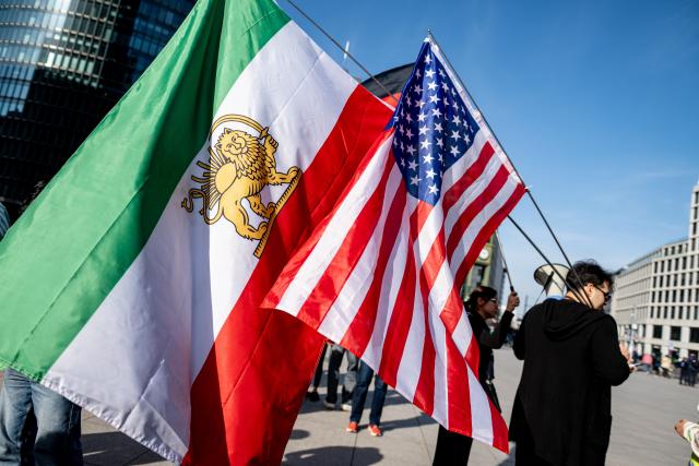 28 February 2026, Berlin: People take part in a demonstration organized by the National Council of Resistance of Iran at Potsdamer Platz. Photo: Fabian Sommer/dpa