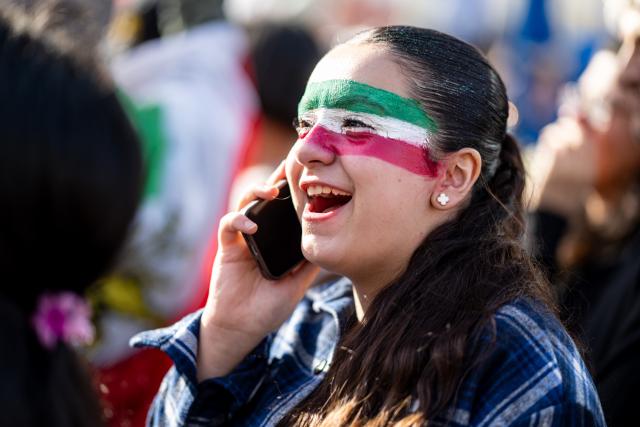 28 February 2026, Berlin: People take part in a demonstration organized by the National Council of Resistance of Iran at Potsdamer Platz. Photo: Fabian Sommer/dpa