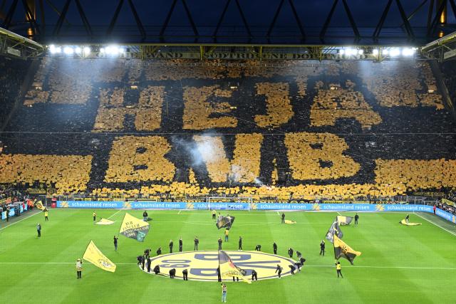 28 February 2026, North Rhine-Westphalia, Dortmund: Dortmund fans in the south stand display a choreographed display with the words "Heja BVB" ahead of the German Bundesliga soccer match between Borussia Dortmund and FC Bayern Munich at Signal Iduna Park. Photo: Federico Gambarini/dpa - IMPORTANT NOTICE: DFL and DFB regulations prohibit any use of photographs as image sequences and/or quasi-video.