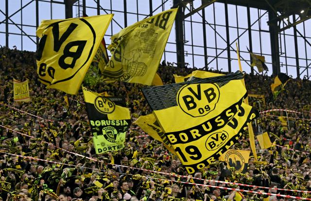 28 February 2026, North Rhine-Westphalia, Dortmund: Borussia Dortmund fans get into the spirit ahead of the German Bundesliga soccer match between Borussia Dortmund and FC Bayern Munich at Signal Iduna Park. Photo: David Inderlied/dpa - IMPORTANT NOTICE: DFL and DFB regulations prohibit any use of photographs as image sequences and/or quasi-video.