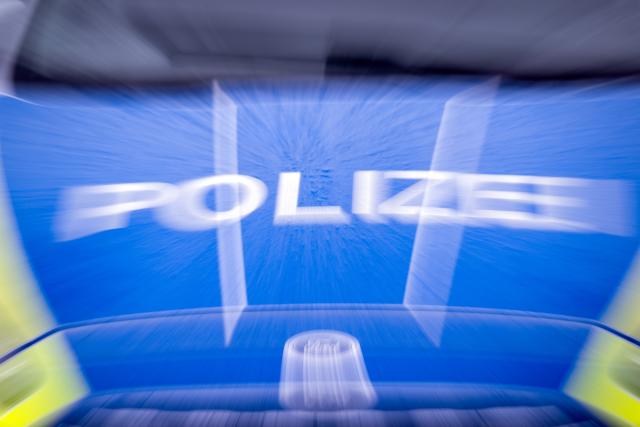 FILED - 22 March 2024, Brandenburg, Trebbin: The word "Polizei" (police) on the hood of a car, photographed during a traffic stop on Berliner Strasse. Photo: Soeren Stache/dpa