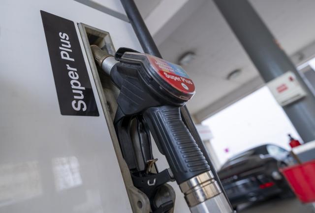 02 March 2026, Bavaria, Munich: A nozzle for fuel (Super Plus) hangs in the holder at a filling station. Photo: Peter Kneffel/dpa