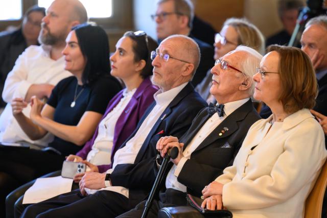 02 March 2026, Lower Saxony, Goettingen: Polish-Swedish Holocaust survivor Leon Weintraub (2nd R) sits in the auditorium of the University of Goettingen during the award ceremony for an honorary doctorate from the University Medical Center Goettingen. Photo: Swen Pförtner/dpa