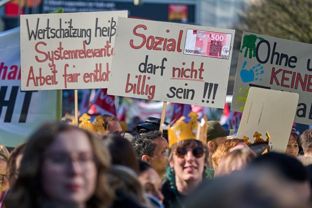 03 March 2026, North Rhine-Westphalia, Dortmund: Employees of the Workers' Welfare Association (AWO) demonstrate holding a banner reading "Solidarity is power". Following several regional warning strikes at AWO facilities, the Verdi union calls for a nationwide AWO strike day in North Rhine-Westphalia. Photo: Bernd Thissen/dpa