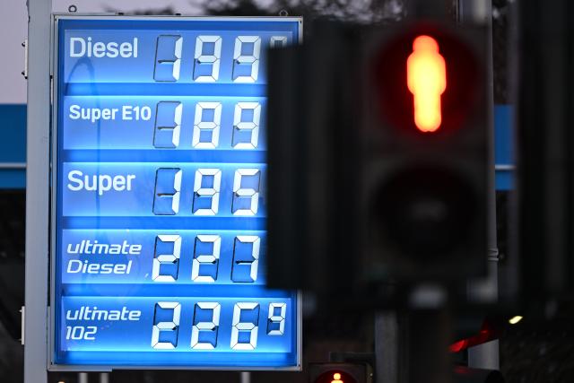 03 March 2026, North Rhine-Westphalia, Cologne: A sign showing fuel prices is displayed at a gas station. Oil prices in Europa are rising significantly due to the war in Iran. Photo: Federico Gambarini/dpa