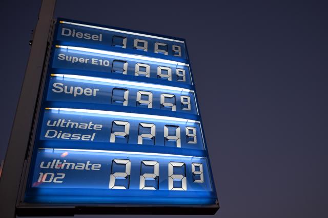 03 March 2026, North Rhine-Westphalia, Cologne: A sign showing fuel prices is displayed at a gas station. Oil prices in Europe are rising significantly due to the war in Iran. Photo: Federico Gambarini/dpa