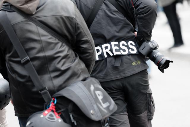 FILED - 01 May 2017, Hamburg: A photojournalist wears a patch with the text "Press" on his jacket at a demonstration. Photo: Markus Scholz/dpa