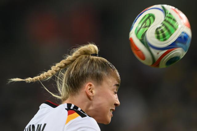 03 March 2026, Saxony, Dresden: Germany's Giulia Gwinn heads the ball during the 2027 FIFA Women's World Cup qualifier League A, Group D, soccer match between Germany and Slovenia at the Rudolf-Harbig-Stadion Photo: Robert Michael/dpa