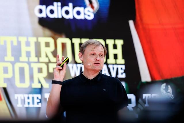 04 March 2026, Bavaria, Herzogenaurach: Bjoern Gulden, CEO of sporting goods manufacturer Adidas AG, stands on stage at the start of the company's annual results press conference. Photo: Daniel Karmann/dpa