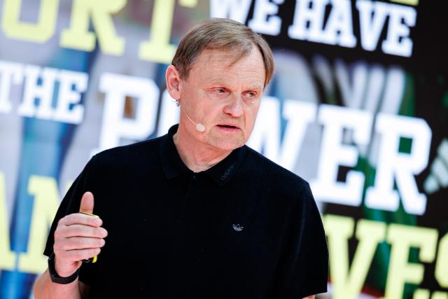 04 March 2026, Bavaria, Herzogenaurach: Bjoern Gulden, CEO of sporting goods manufacturer Adidas AG, stands on stage at the start of the company's annual results press conference. Photo: Daniel Karmann/dpa