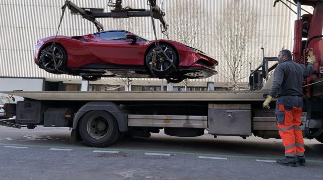 04 March 2026, Berlin: Police officers seize a Ferrari and a Lamborghini as police and tax investigators search several properties. Photo: Carsten Koall/dpa