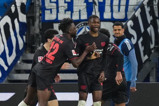 04 March 2026, Hamburg: Bayer Leverkusen's Christian Kofane celebrates scoring his side's first goal during the German Bundesliga soccer match between Hamburger SV and Bayer Leverkusen at the Volksparkstadion. Photo: Marcus Brandt/dpa - IMPORTANT NOTICE: DFL and DFB regulations prohibit any use of photographs as image sequences and/or quasi-video.