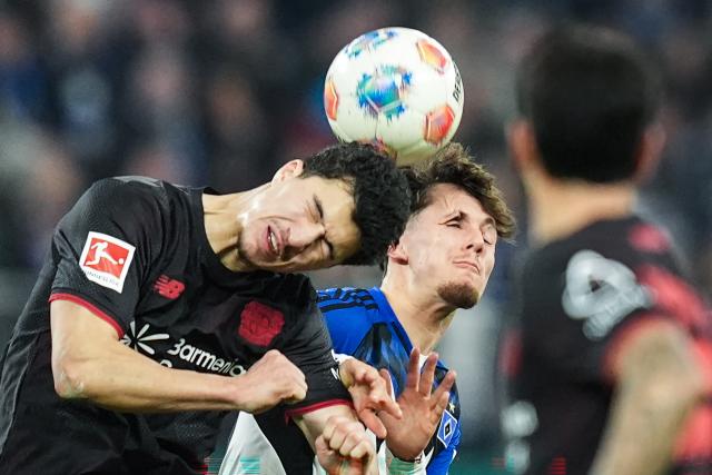 04 March 2026, Hamburg: Bayer Leverkusen's Ibrahim Maza and Hamburger's Otto Stange in action during the German Bundesliga soccer match between Hamburger SV and Bayer Leverkusen at the Volksparkstadion. Photo: Marcus Brandt/dpa - IMPORTANT NOTICE: DFL and DFB regulations prohibit any use of photographs as image sequences and/or quasi-video.
