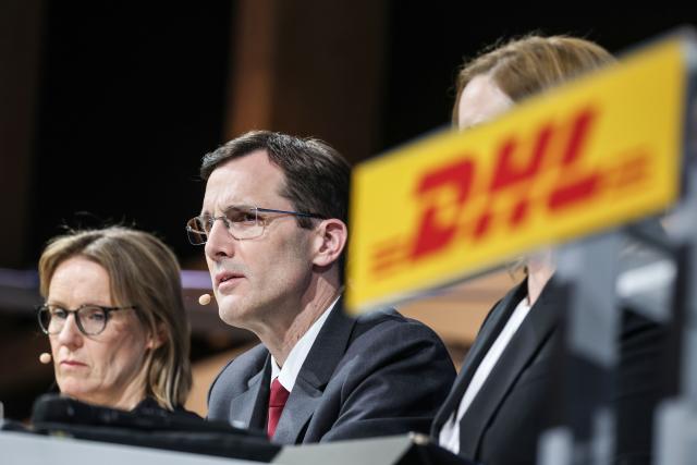 05 March 2026, North Rhine-Westphalia, Troisdorf: Tobias Meyer (r), CEO of DHL Group, speaks alongside Melanie Kreis, CFO, at the annual press conference on the financial year 2025. Photo: Oliver Berg/dpa