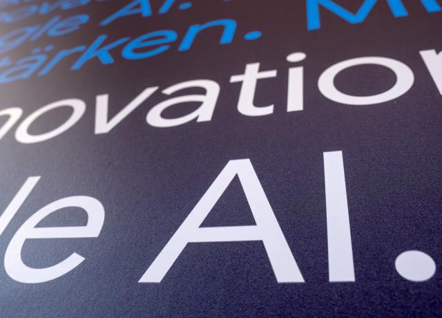 05 March 2026, Berlin: The letters "AI" for Artificial Intelligence are displayed on a wall after the press conference marking the opening of the Google AI Center Berlin. Photo: Soeren Stache/dpa