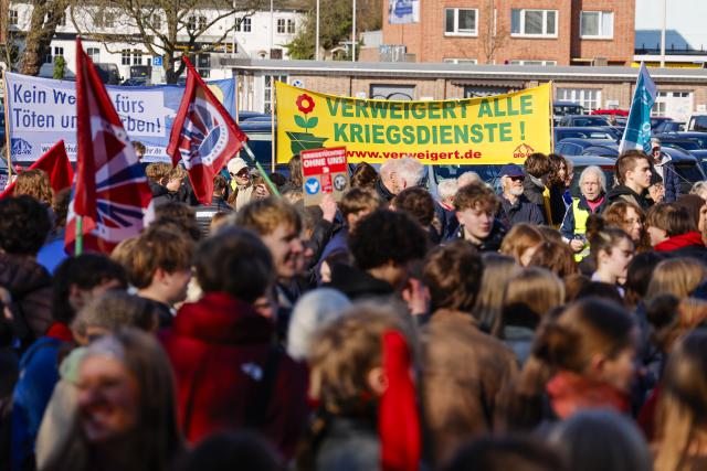 05 March 2026, Schleswig-Holstein, Kiel: Participants carry placards with slogans during a demonstration, as part of a nationwide school strike against compulsory military service. Photo: Frank Molter/dpa