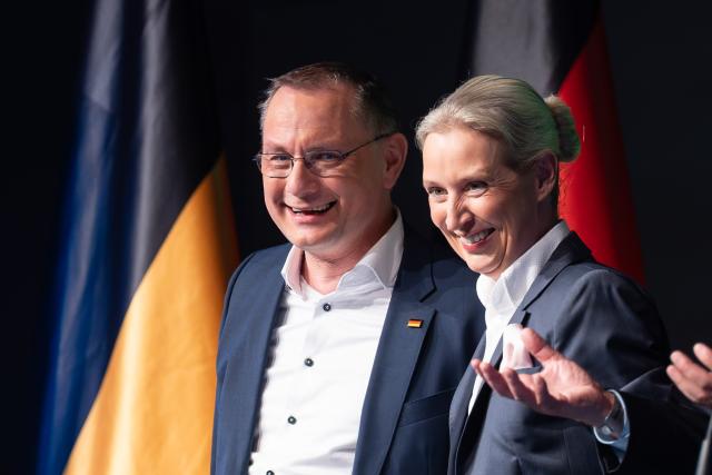 05 March 2026, Baden-Württemberg, Rottweil: Tino Chrupalla (L), Chairman of the Alternative for Germany (AfD) parliamentary group, and Alice Weidel, Chairwoman of the AfD parliamentary group react during the AfD Baden-Wuerttemberg election campaign closing at the Rottweil town hall. Photo: Silas Stein/dpa