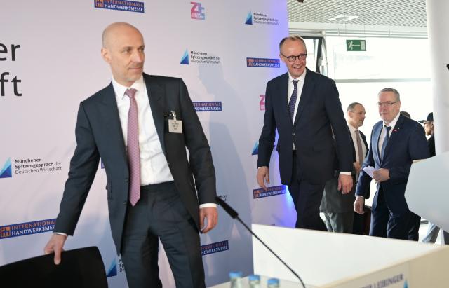 06 March 2026, Bavaria, Munich: Peter Leibinger, President of the Federation of German Industries, German Chancellor Friedrich Merz and Joerg Dittrich, President of the German Confederation of Skilled Crafts, will be attending the top-level talks of German industry at the International Skilled Crafts Fair. Photo: Malin Wunderlich/dpa
