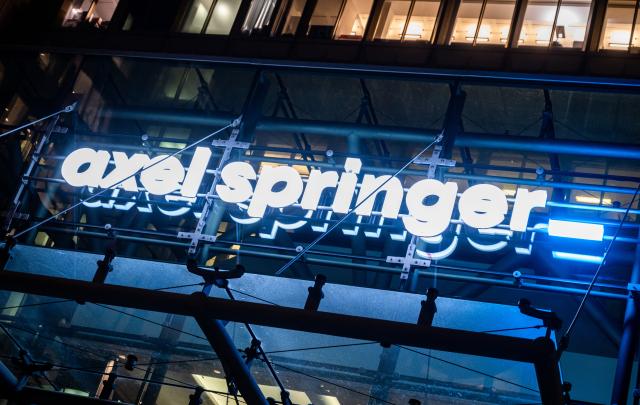 FILED - 25 November 2020, Berlin: The company logo is displayed above the entrance to Axel Springer's headquarters. Photo: Christophe Gateau/dpa