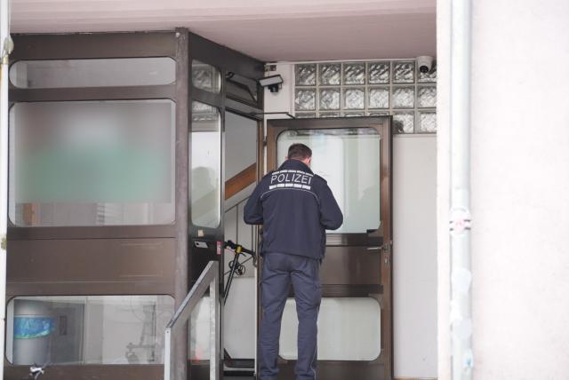 06 March 2026, Baden-Wuerttemberg, Backnang: A criminal investigation officer is on duty in front of a mosque in the Rems-Murr district. One person was injured in a knife attack, according to a police spokesperson. Photo: Enrique Kaczor/onw-images/dpa