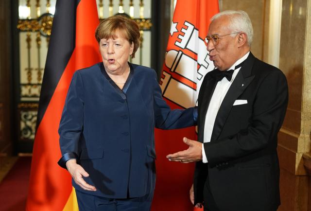 06 March 2026, Hamburg: Former German Chancellor Angela Merkel (L) and President of the European Council Antonio Costa stand at the Hall of Mirrors at City Hall during the traditional Matthiae-Mahl banquet hosted by the Hamburg Senate. Photo: Marcus Brandt/dpa