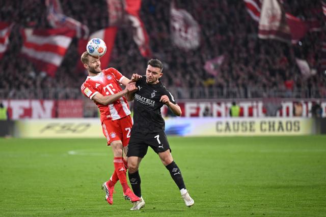 06 March 2026, Bavaria, Munich: Bayern Munich's Konrad Laimer (L) and Borussia Moenchengladbach's Kevin Stoeger battle for the ball during the German Bundesliga soccer match between Bayern Munich and Borussia Moenchengladbach at the Allianz Arena. Photo: Harry Langer/dpa - IMPORTANT NOTICE: DFL and DFB regulations prohibit any use of photographs as image sequences and/or quasi-video.