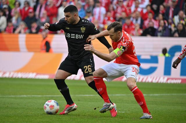 07 March 2026, Rhineland-Palatinate, Mainz: Stuttgart's Chema (L) and Mainz' Silas Ka-Tompa Mvumpa battle for the ball during the German Bundesliga soccer match between FSV Mainz 05 and VfB Stuttgart at the Mewa Arena. Photo: Torsten Silz/dpa - IMPORTANT NOTICE: DFL and DFB regulations prohibit any use of photographs as image sequences and/or quasi-video.