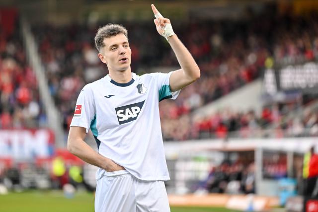 07 March 2026, Baden-Württemberg, Heidenheim: Hoffenheim's Fisnik Asllani celebrates scoring his side's third goal during the German Bundesliga soccer match between FC Heidenheim and TSG 1899 Hoffenheim at the Voith-Arena. Photo: Harry Langer/dpa - IMPORTANT NOTICE: DFL and DFB regulations prohibit any use of photographs as image sequences and/or quasi-video.