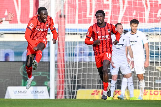 07 March 2026, Baden-Württemberg, Heidenheim: Heidenheim's Sirlord Conteh and Christian Conteh celebrate a goal that was later disallowed for an offside during the German Bundesliga soccer match between FC Heidenheim and TSG 1899 Hoffenheim at the Voith-Arena. Photo: Harry Langer/dpa - IMPORTANT NOTICE: DFL and DFB regulations prohibit any use of photographs as image sequences and/or quasi-video.