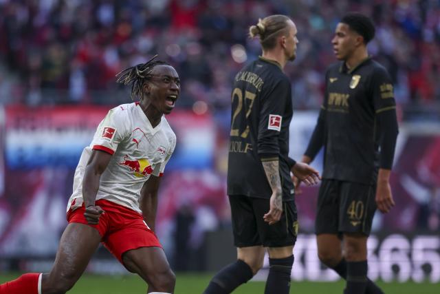 07 March 2026, Saxony, Leipzig: Leipzig's Yan Diomande celebrates scoring his side's first goal during the German Bundesliga soccer match between RB Leipzig and FC Augsburg at the Red Bull Arena. Photo: Jan Woitas/dpa - IMPORTANT NOTICE: DFL and DFB regulations prohibit any use of photographs as image sequences and/or quasi-video.