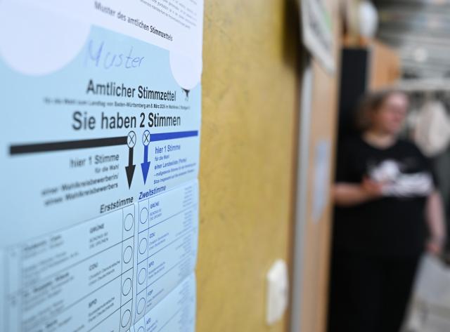 08 March 2026, Baden-Wuerttemberg, Stuttgart: A sample official ballot paper hangs outside a polling station ahead of the state elections to be held in Baden-Wuerttemberg on March 8. Photo: Bernd Weißbrod/dpa