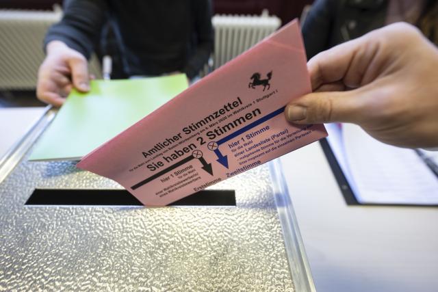 08 March 2026, Baden-Württemberg, Stuttgart: A voter casts his ballot at a polling station in the city center. State elections will be held in Baden-Wuerttemberg on March 8. Photo: Marijan Murat/dpa