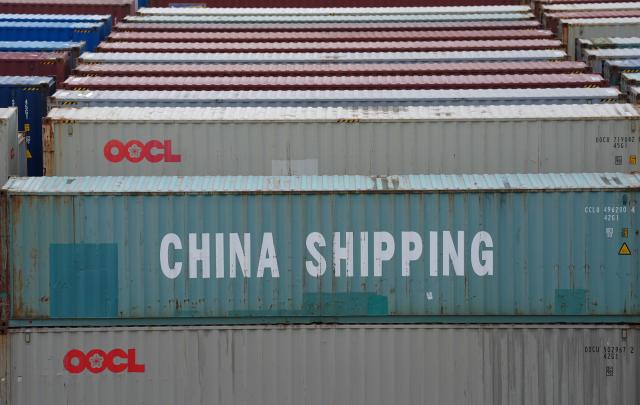 FILED - 09 July 2025, Hamburg: A container from China Shipping Container Lines (CSCL) stands among countless other containers at the Tollerort container terminal in the port of Hamburg. China's foreign trade surged at the start of the year, with exports and imports rising far more strongly than expected, official data showed on Tuesday. Photo: Marcus Brandt/dpa