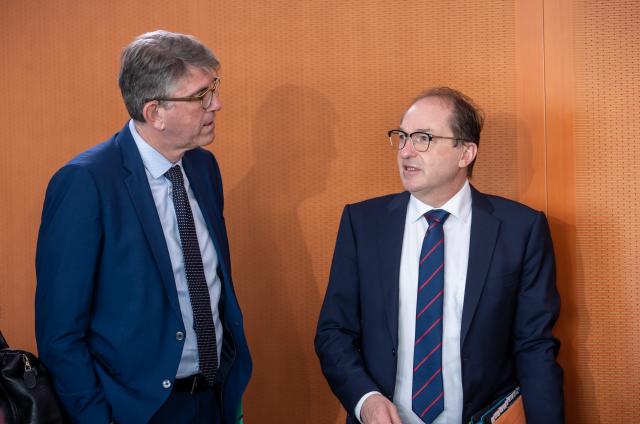 11 March 2026, Berlin: German Minister of State for Culture and Media Wolfram Weimer (L) talks with Minister of the Interior Alexander Dobrindt before the Federal Cabinet meeting at the Federal Chancellery. Photo: Michael Kappeler/dpa