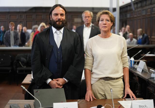 12 March 2026, Hamburg: Christina Block (R), German restaurateur; her defense attorney Ingo Bott (L); and former sports journalist Gerhard Delling (back center) stand in the courtroom at Hamburg Regional Court during the trial for alleged child abduction, stemming from a covert operation on New Year's Eve 2023/24, in which Block's two children were brought from Denmark to Germany. Photo: Marcus Brandt/Pool dpa/dpa