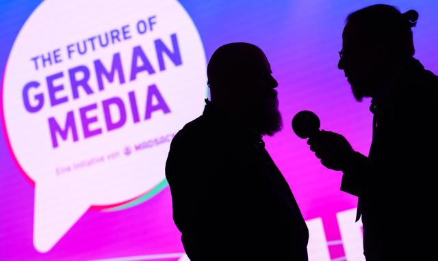 12 March 2026, Lower Saxony, Hanover: A radio journalist interviews publisher Holger Friedrich (L) at the event "The Future of German Media," held at Madsack's historic printing plant, as the industry gathering focuses on the key factors for success in journalism in today's digital world. Photo: Julian Stratenschulte/dpa