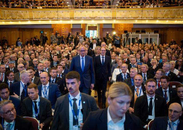 12 March 2026, Hesse, Wiesbaden: German Chancellor Friedrich Merz, German Minister of the Interior Alexander Dobrindt (C R), and BKA President Holger Muench attend the ceremony to mark the 75th anniversary of the Federal Criminal Police Office (BKA) at the Wiesbaden Kurhaus. Photo: Soeren Stache/dpa
