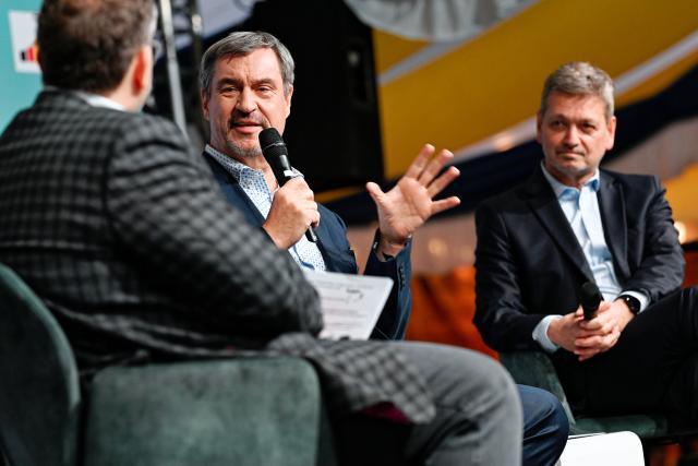 12 March 2026, Rhineland-Palatinate, Frankenthal: Bavarian Minister-President Markus Soeder and CDU candidate Christian Baldauf sit on stage in a marquee during an election campaign event in March 2026. Photo: Uwe Anspach/dpa