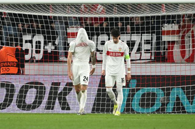 12 March 2026, Baden-Württemberg, Stuttgart: VfB Stuttgart's Jeff Chabot and Atakan Karazor react after conceding a goal during the UEFA Europa League soccer match between VfB Stuttgart and FC Porto at the MHPArena. Photo: Marijan Murat/dpa