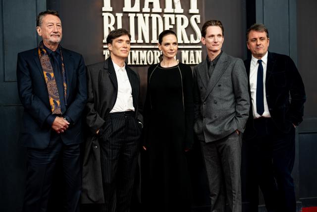 12 March 2026, Berlin: Steven Knight, writer, Cillian Murphy, actor, Rebecca Ferguson, actress, Tom Harper, director, and Guy Heeley, producer, stand on the red carpet at the premiere of "Peaky Blinders: The Immortal Man". Photo: Fabian Sommer/dpa